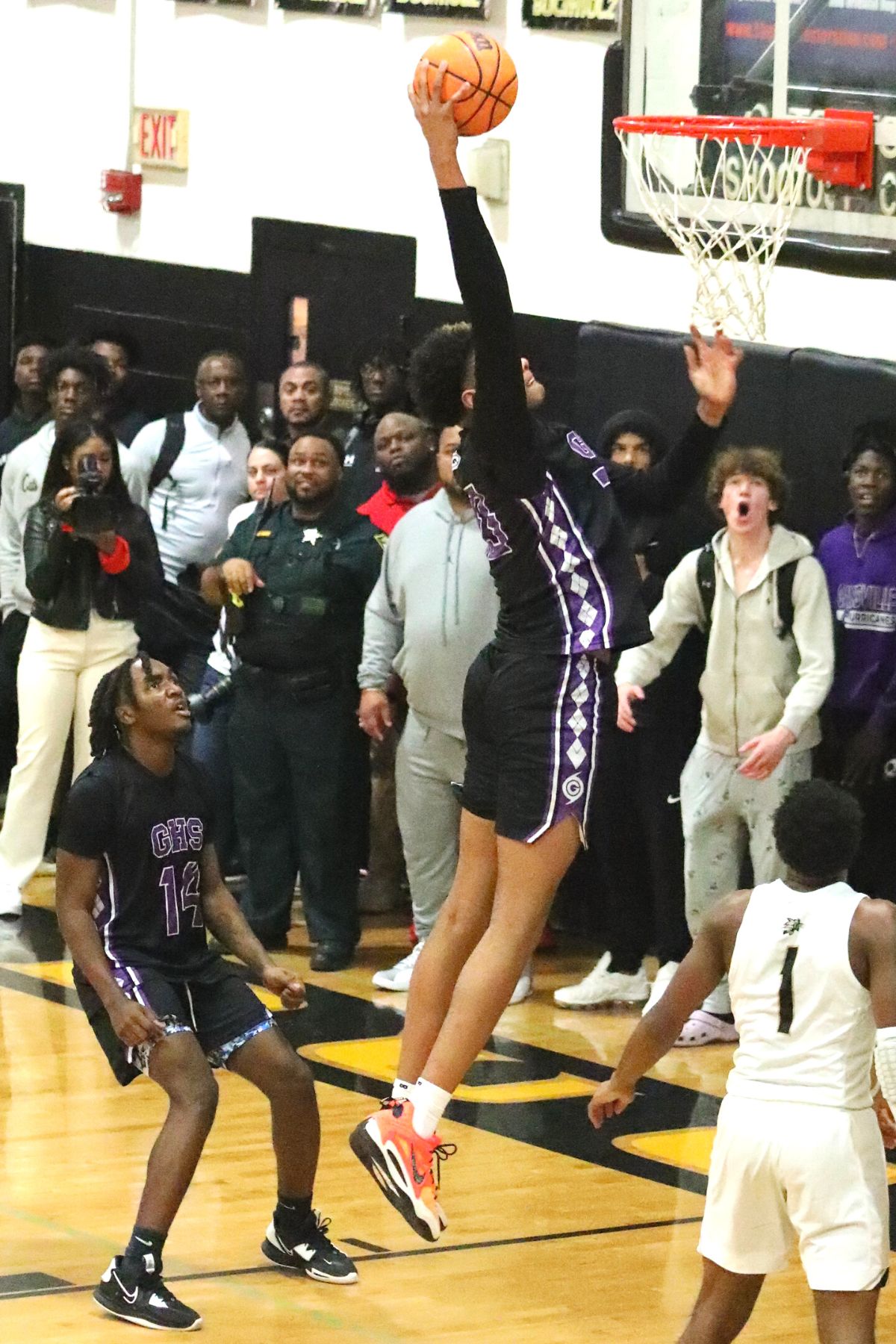 Gainesville's Josh Hayes with a first-half dunk against Buchholz on Friday.