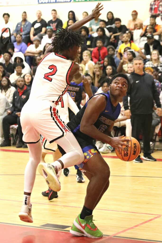 Newberry's Logan McCloud (10) attempts a shot against Williston's Javon Brown (2) on Friday.