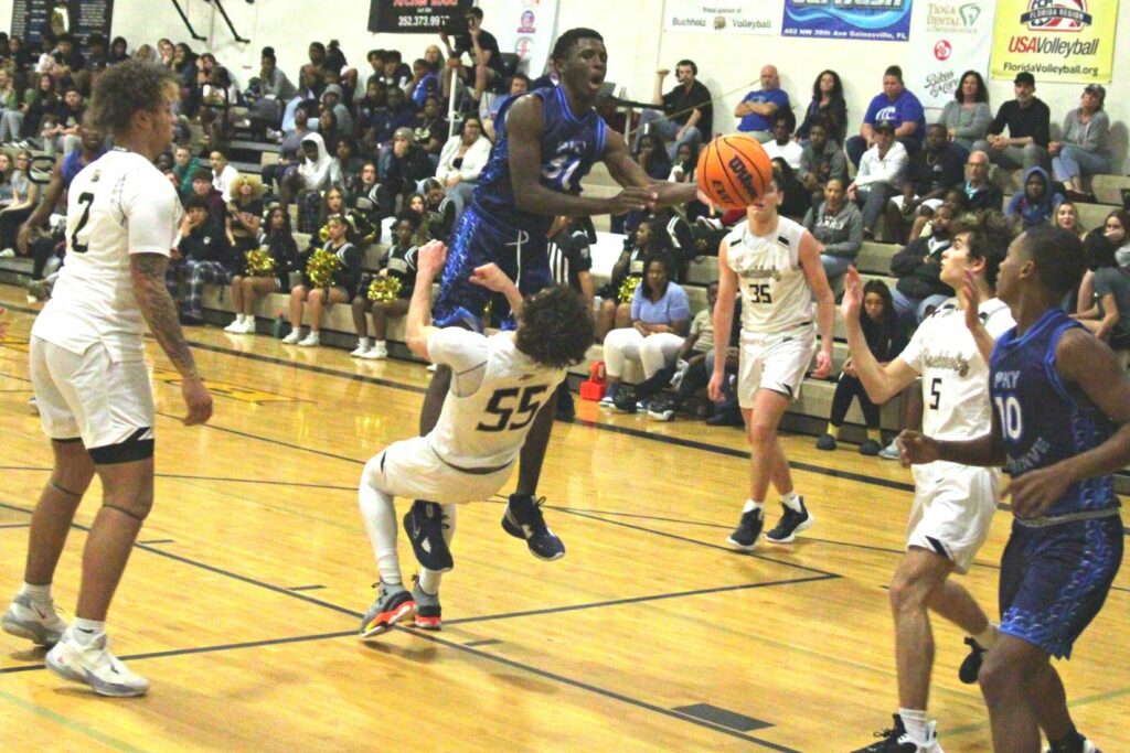 P.K. Yonge's Isaiah Cooper drives on Buchholz's Ryan Webster on Wednesday.