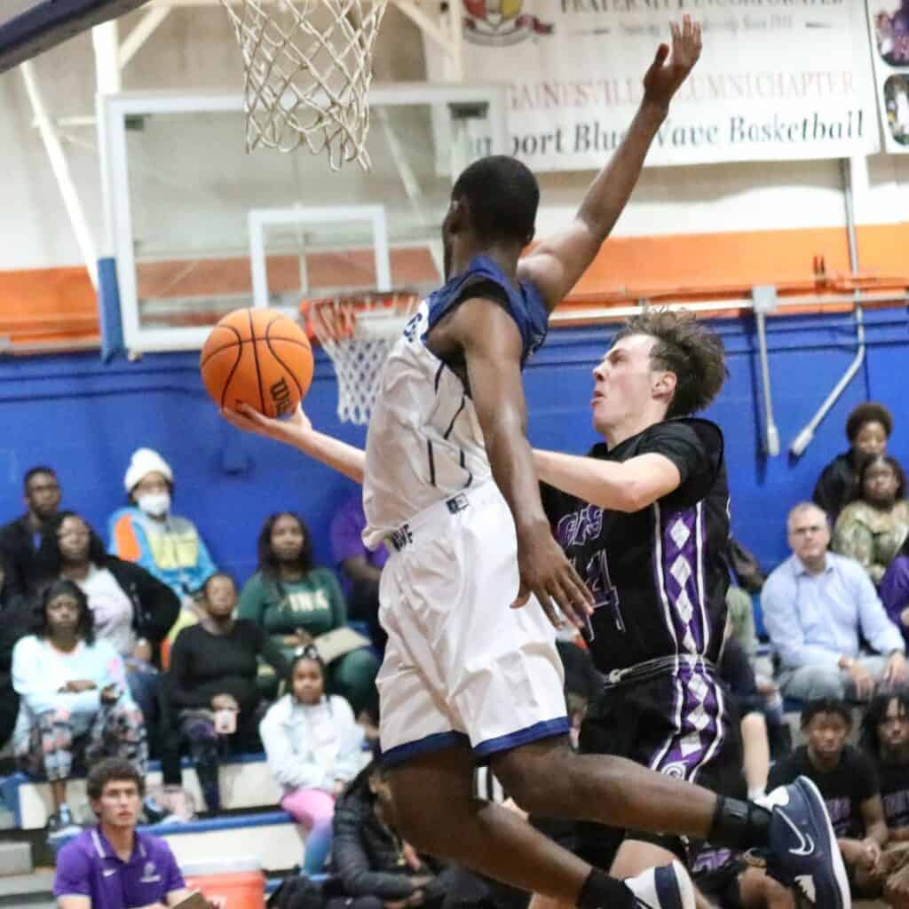 P.K. Yonge's Randall Robinson blocks Gainesville's Anthony Leivonen's fourth quarter shot on Tuesday.
