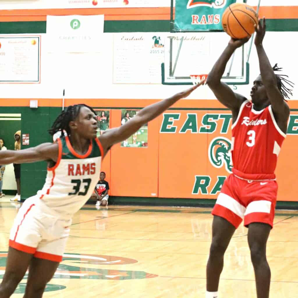 Santa Fe's Don'trell Jenkins shoots a first quarter 3-pointer over Eastside's Davion Pugh on Tuesday.