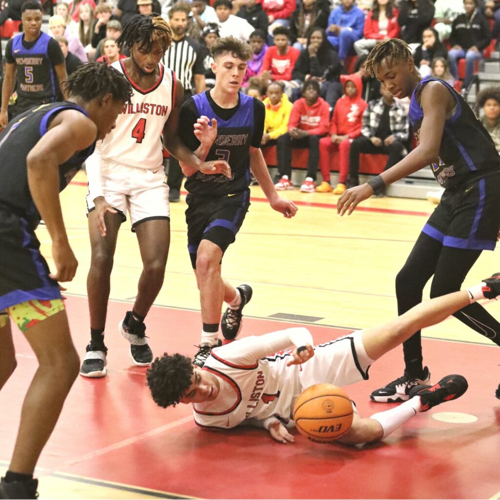 Williston's Jeythian Merced goes for a loose ball against Newberry on Friday.