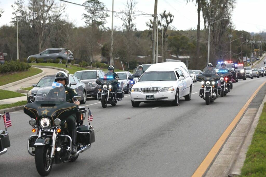 A law enforcement procession for Alachua County Sheriff's deputy Nikolas Tilliman traveled down W. Newberry Road in Gainesville on Friday afternoon.