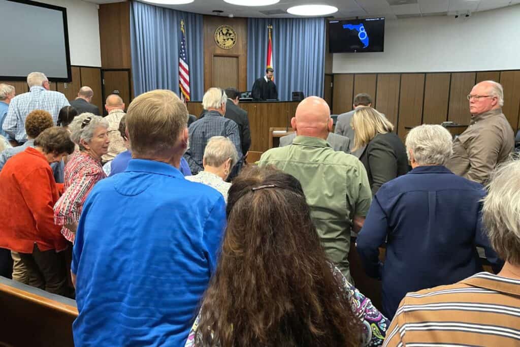 Attendees rise as Judge George Wright ends the proceeding at the Bradford County Courthouse on Tuesday.