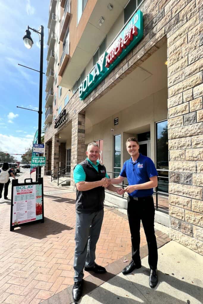 Bolay team members Mike Harper (left) and Eric Huffman outside the new Bolay Kitchen in Gainesville.