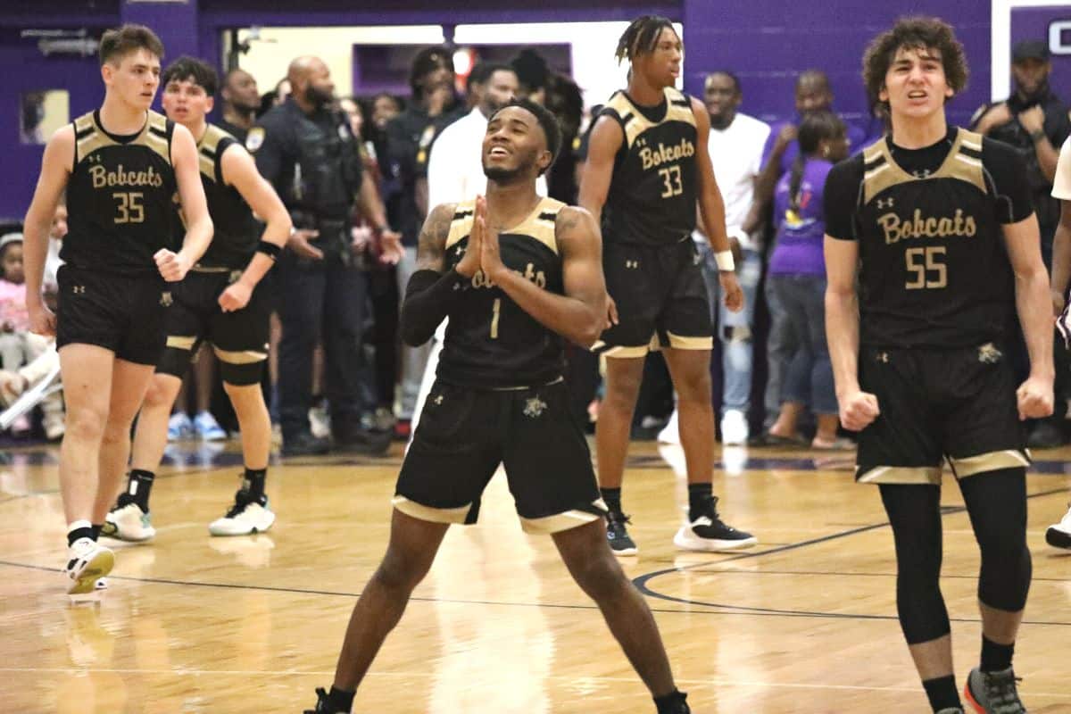 Buchholz's Tyler Gainey (1) and Ryan Webster (55) celebrate after the Bobcats pull within 2 points late in the game against Gainesville in the District 6A-2 championship game on Friday.