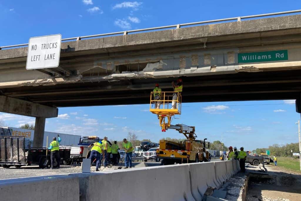 Crews working on the SW 66th StreetWilliams Road overpass after an oversized tractor-trailer hit and damaged the underside on Wednesday morning.