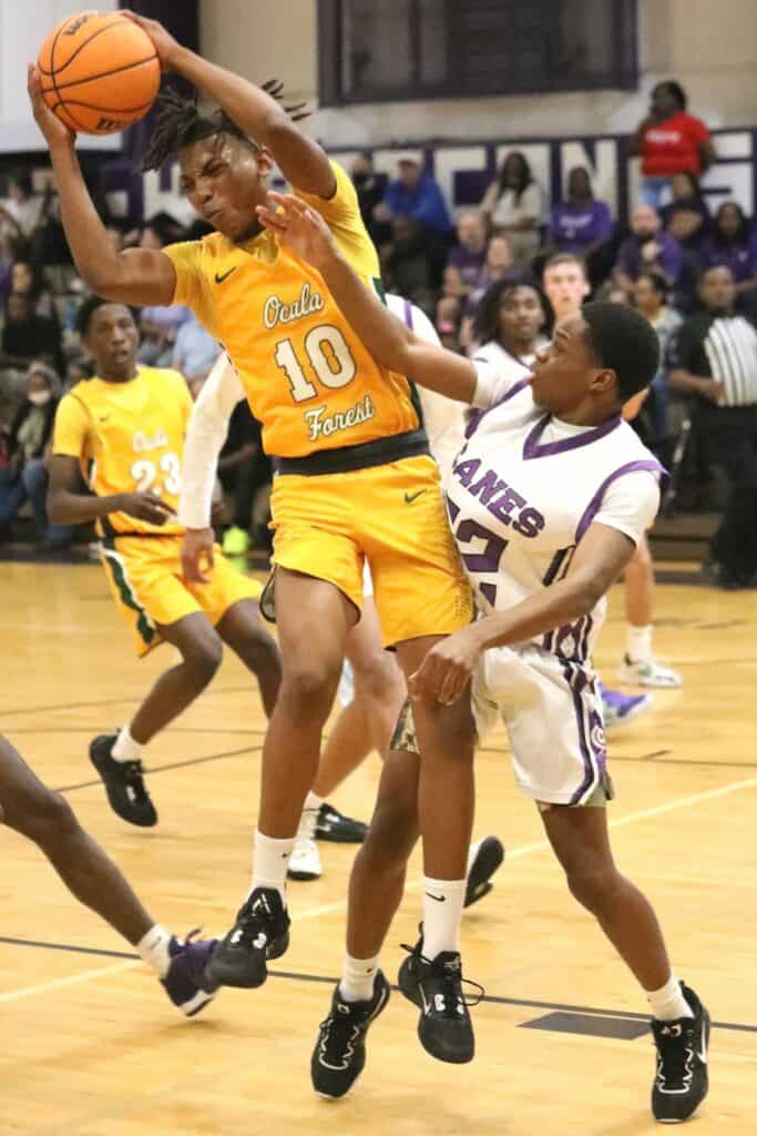 Gainesville's Elijah Williams (22) defends Forest's Xavier Kirkpatrick (10) in the Region 1-6A quarterfinals on Thursday.
