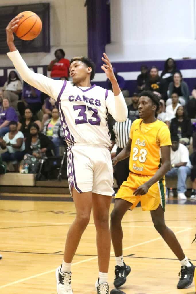 Gainesville's Josh Hayes with one of his 20 rebounds against Forest in the Region 1-6A quarterfinals on Thursday.