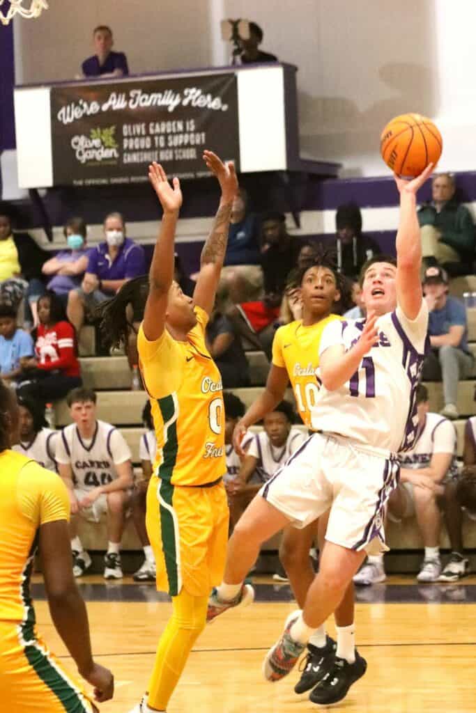 Gainesville's Seth Childers with a running baseline jumper against Forest in the Region 1-6A quarterfinals on Thursday.