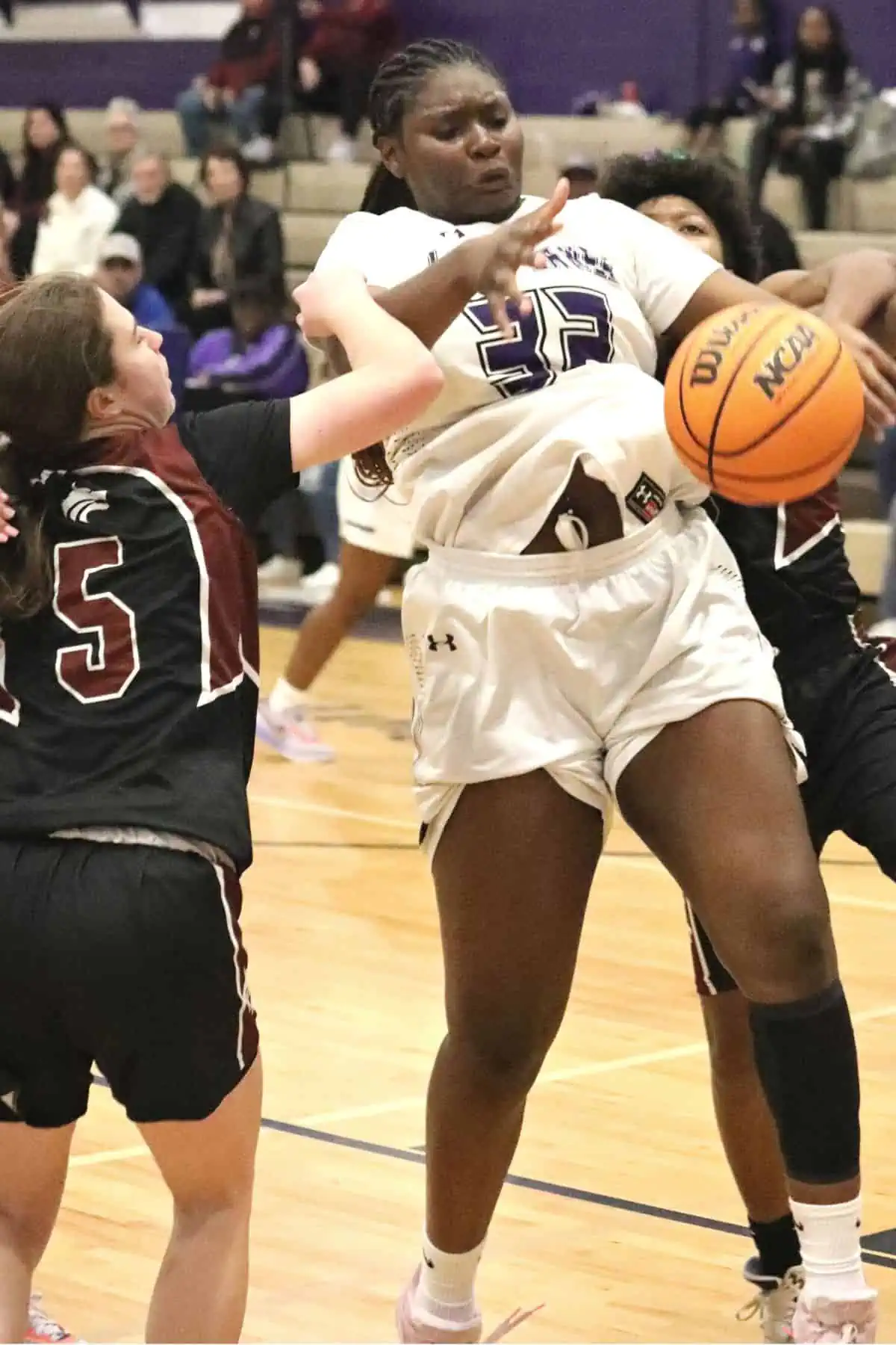 Gainesville's Ta'Niyah Walker goes for a rebound against Chiles in the third quarter on Friday.