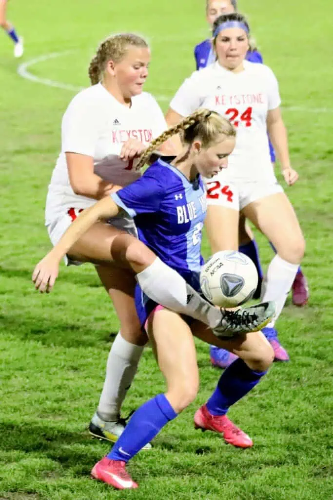 Keystone Heights' Parker Collins battles P.K. Yonge's Faith Hardy for the ball in the second half on Thursday.