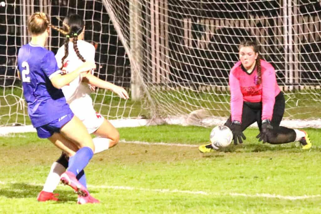 Keystone Heights' goalkeeper Aspen Krohn with a first half save against PK Yonge's Faith Hardy on Thursday.