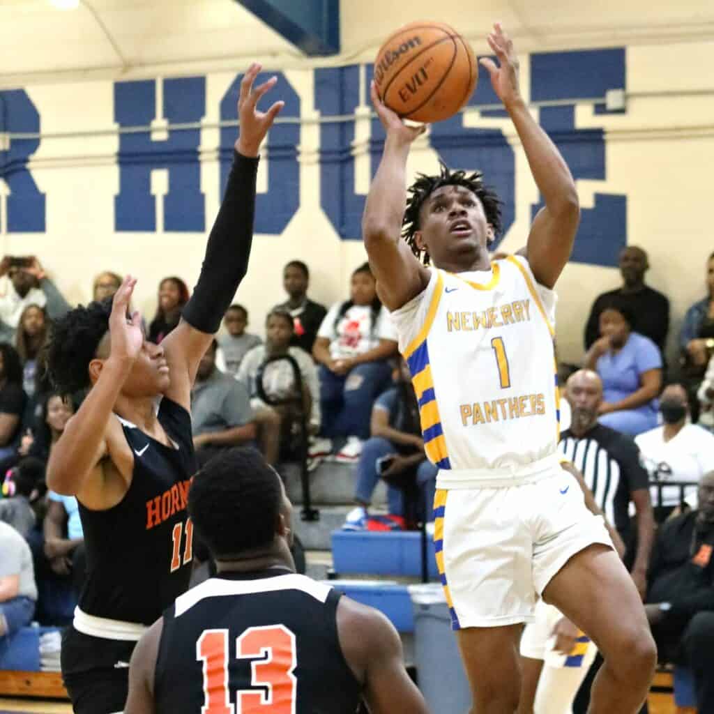 Newberry's Michael Moore with a shot attempt against Hawthorne in the District 1A-6 championship game on Friday.