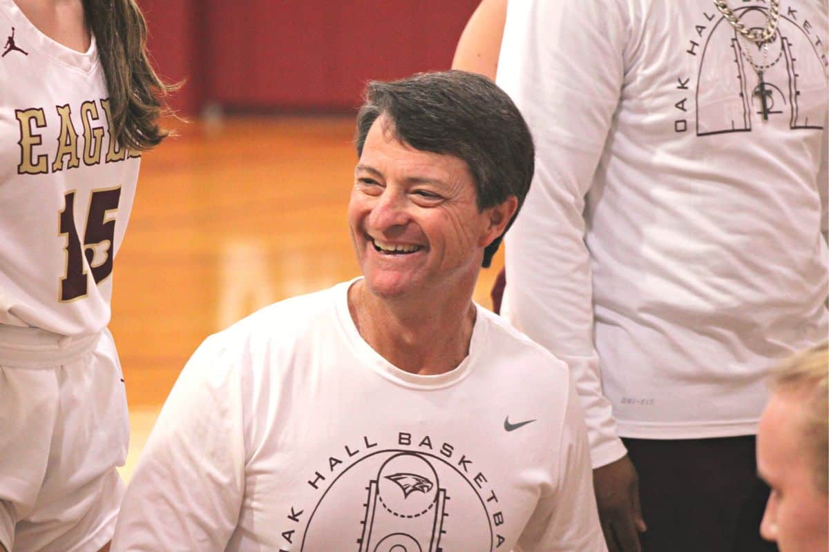 Oak Hall head coach Eric Ringdahl smiles in one of the final time outs of his 31 years leading the Eagles girls basketball team on Thursday.