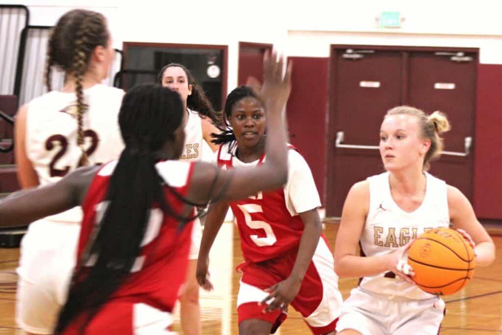 Oak Hall's Kate Pickens looks to pass in the Eagles' Class 2A-Region 1 Quarterfinal home loss to North Florida Educational Institute (Jacksonville) on Thursday.