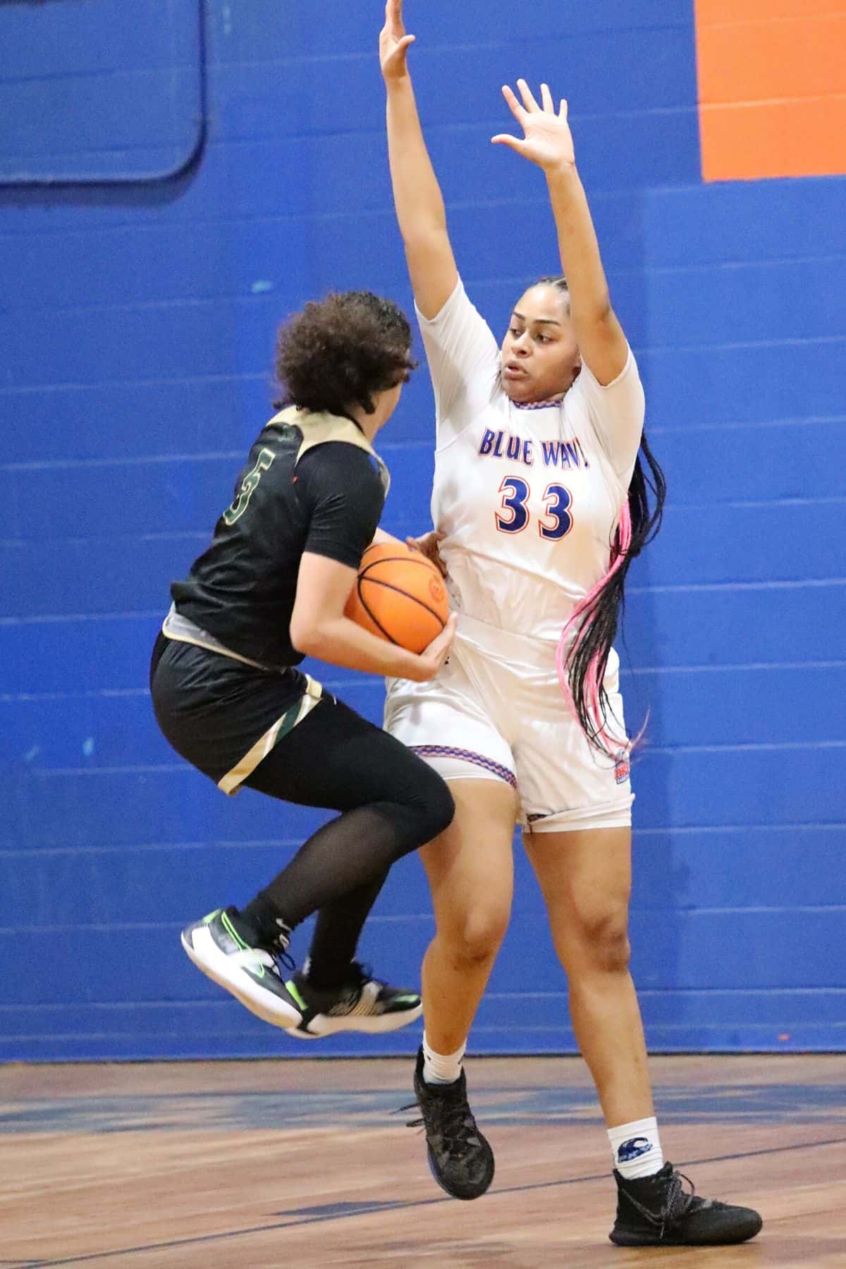 P.K. Yonge's Da'mar Wims defends against Trinity Catholic on Friday.