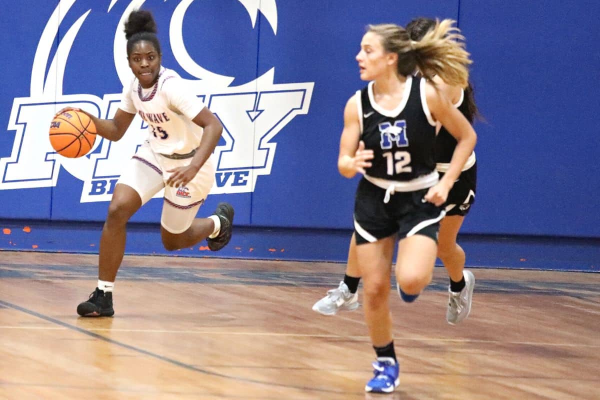 P.K. Yonge's Reniyah Clark dribbles up court against Master's Academy in the Region 1-3A semifinals game on Tuesday.