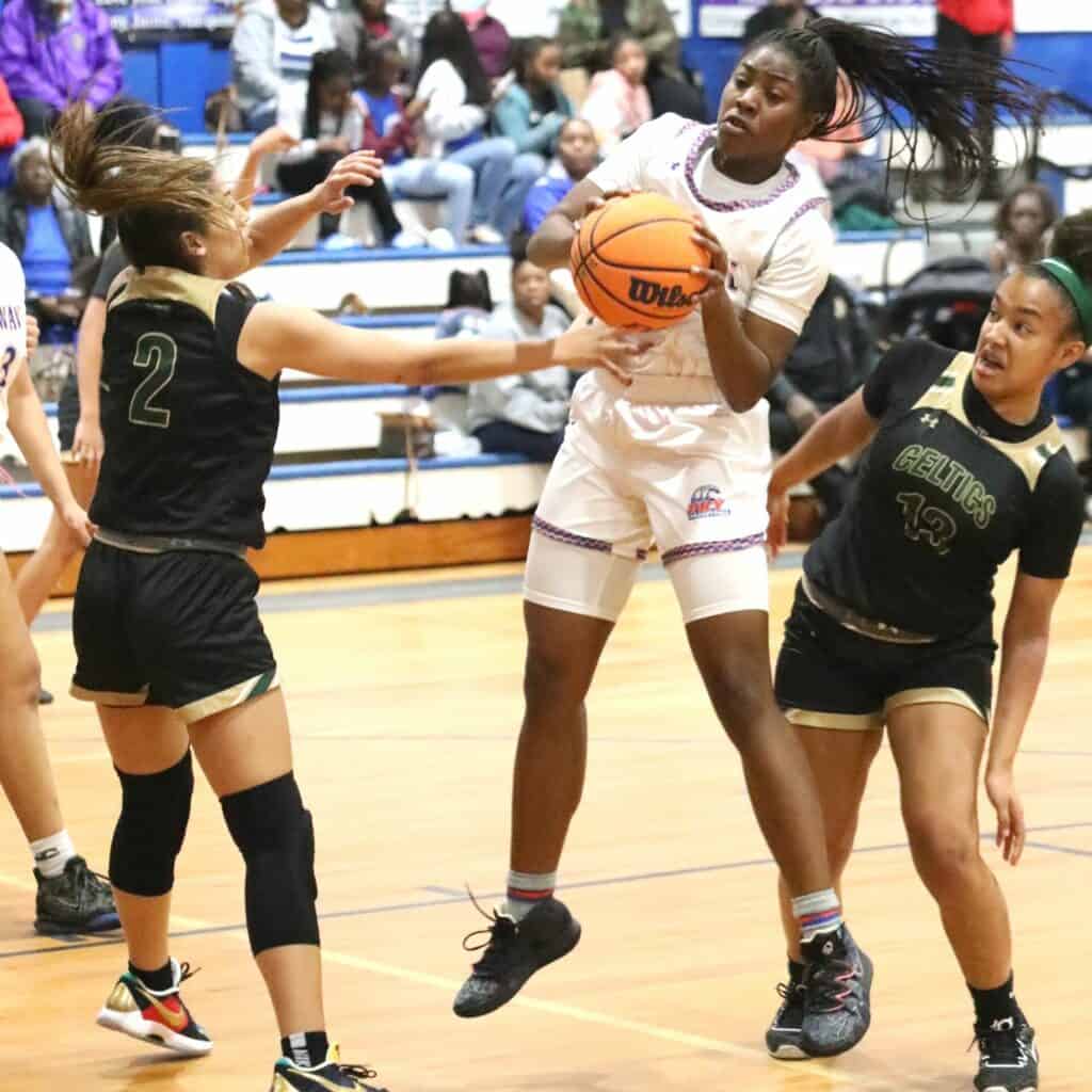 P.K. Yonge's Reniyah Clark with a first half rebound against Trinity Catholic on Friday.