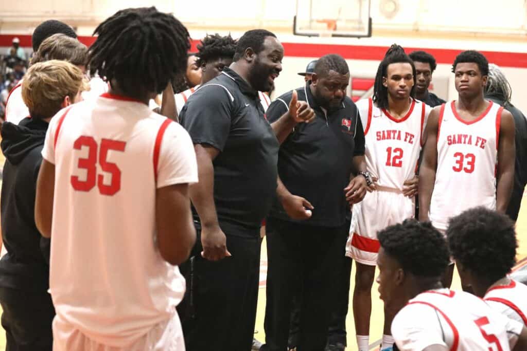 Santa Fe coach Glen Banks rallies the Raiders after Cocoa's third quarter rally in the Region 2-4A semifinals on Tuesday.