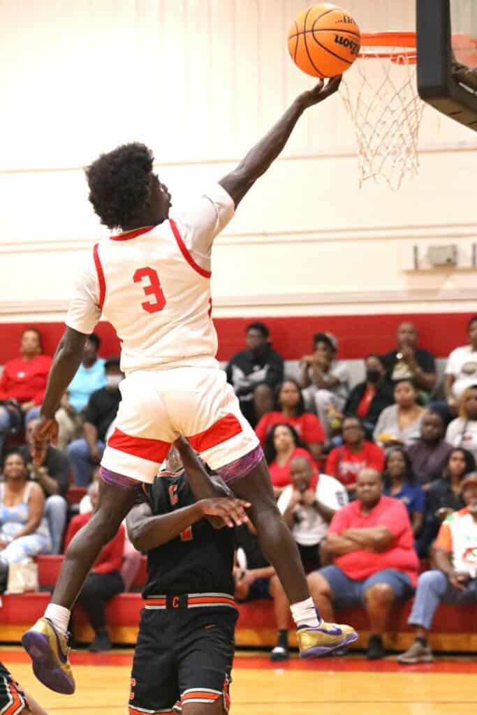 Santa Fe's Don'trell Jenkins scores two of his 18 points in the Region 2-4A semifinals against Cocoa on Tuesday.