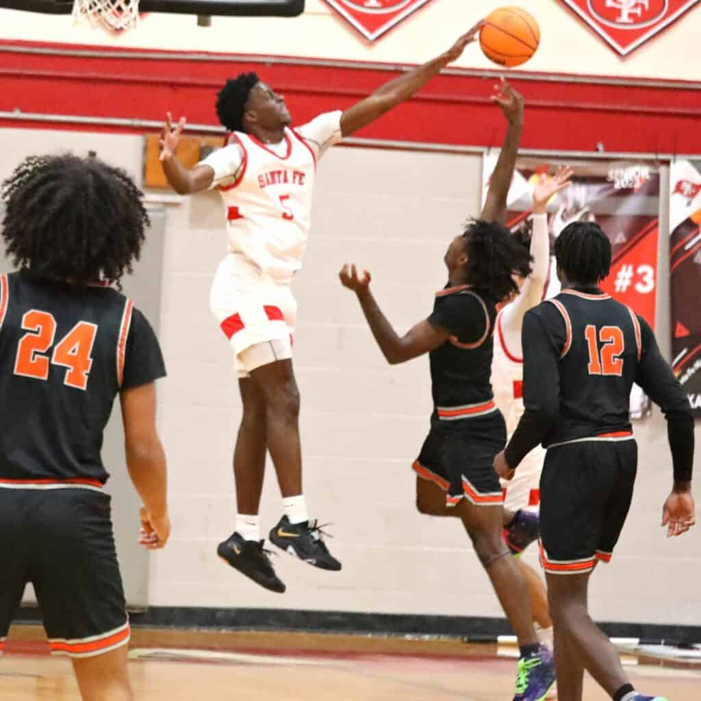 Santa Fe's Kyren Washington (5) goes for a block in the Region 2-4A semifinals against Cocoa on Tuesday.