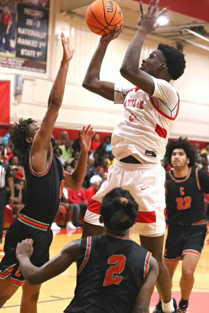 Santa Fe's Kyren Washington (5) shoots for two of his 20 points in the Region 2-4A semifinals against Cocoa on Tuesday.