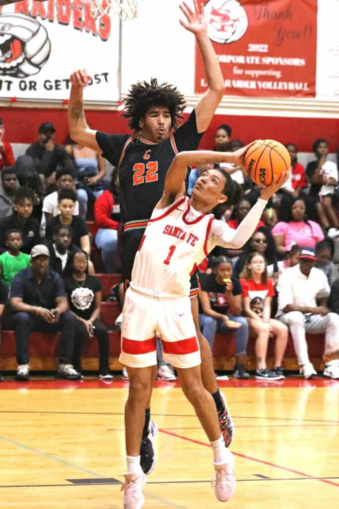 Santa Fe's Makhi Lewis (1) takes a fourth quarter shot in the Region 2-4A semifinals against Cocoa on Tuesday. (1)