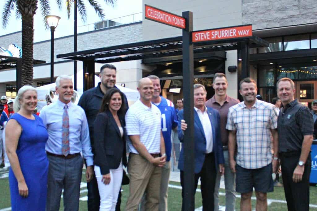 Steve Spurrier (hand on post) was honored at Celebration Pointe with a road naming ceremony on Friday.