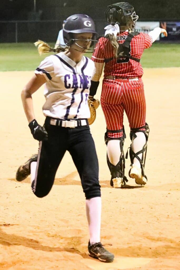 Gainesville's Elise Knopf scores the Hurricanes' first run in the bottom of the fourth inning against visiting Williston on Monday.