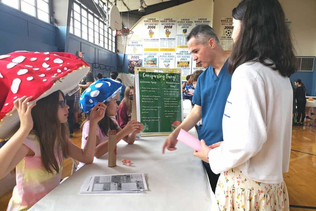 Lincoln Middle School sixth graders present a fungi comparison at its Germ Museum on Wednesday.