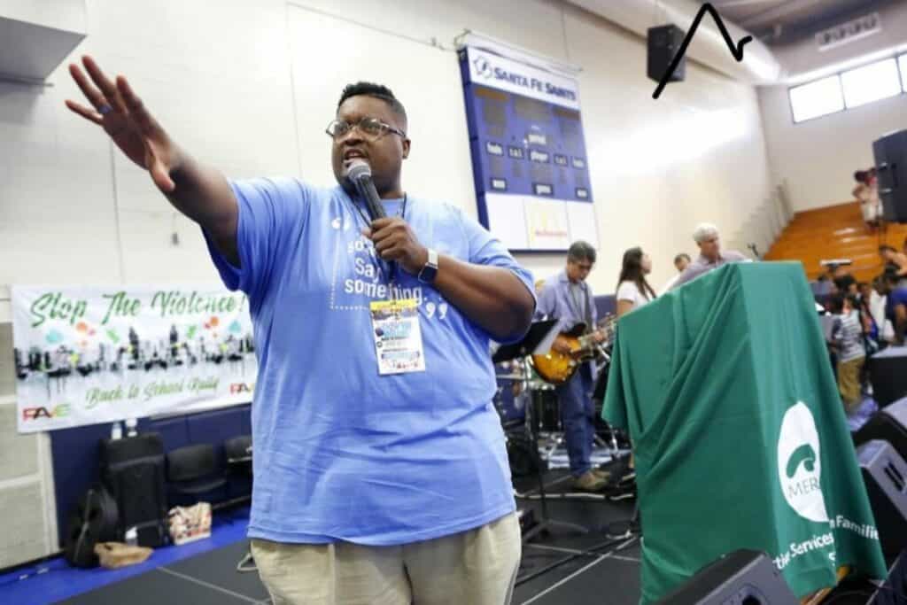 Pastor Karl Anderson speaking at P.A.V.E.'s Stop the Violence rally.