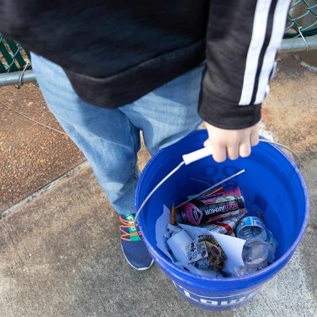 Westwood sixth grader Isaiah Pinero displays the contents of his bucket.