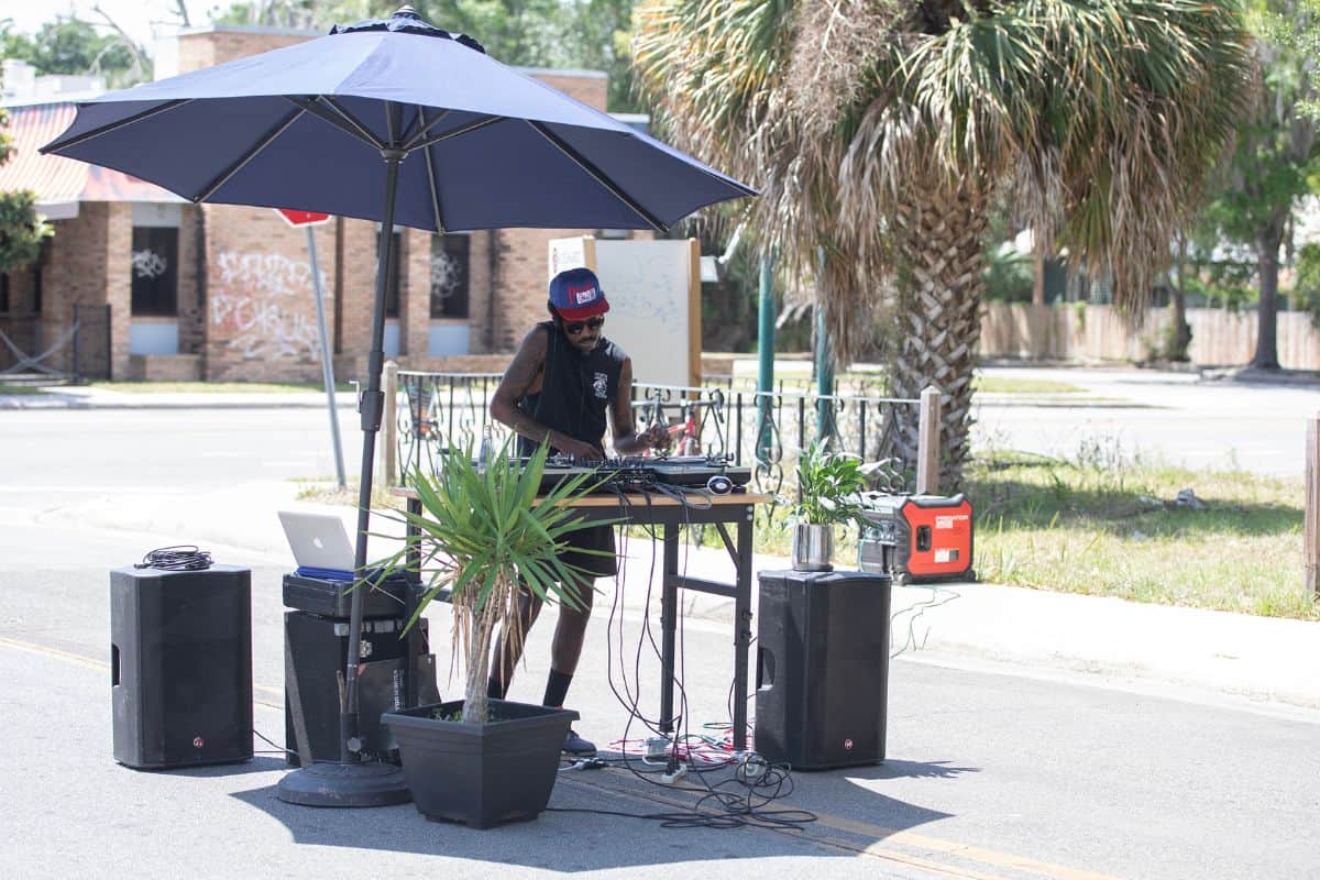 A DJ plays tunes for visitors on Saturday.
