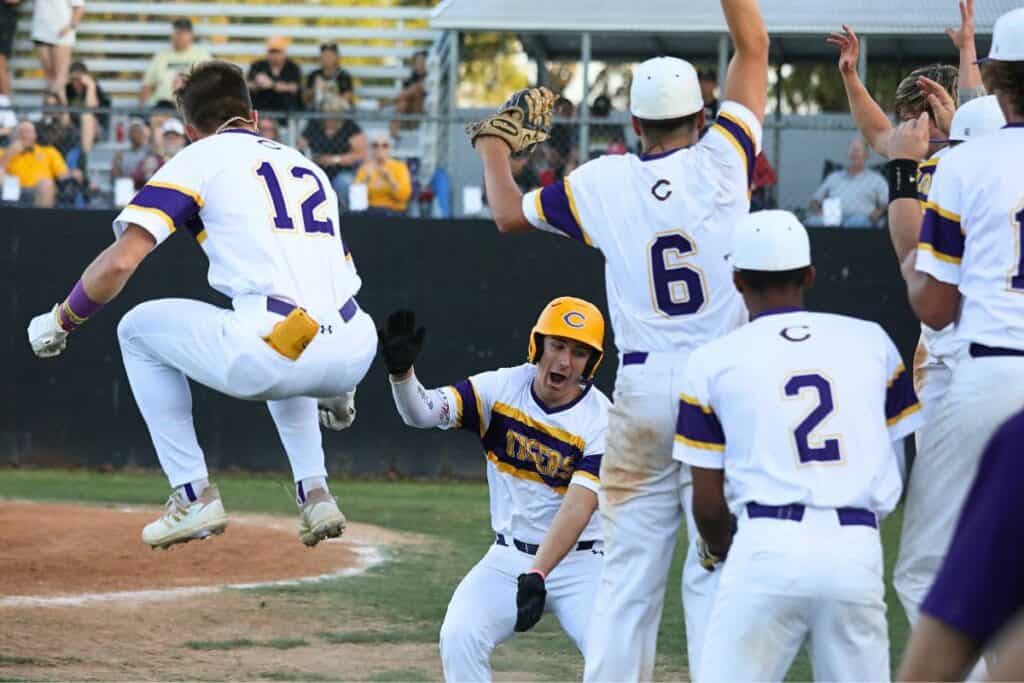 Columbia's Ayden Phillips (black gloves) celebrates his two-run homer in the bottom of the first with his teammates against visiting Buchholz on Tuesday. (1)