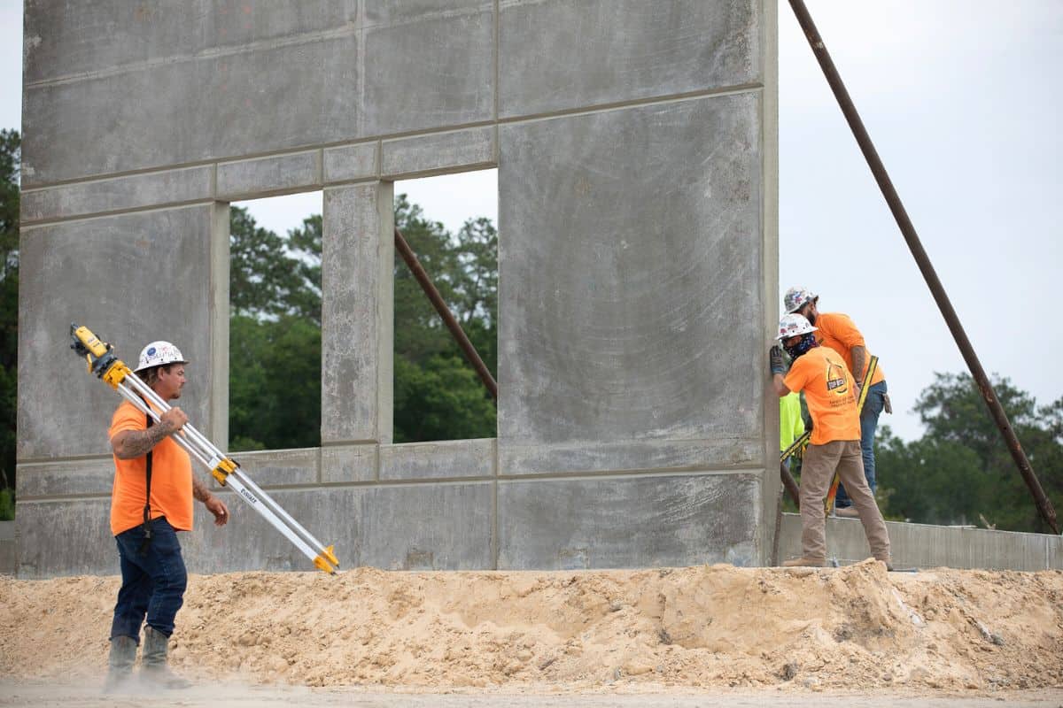 Construction workers secure the wall at Westwood Middle School into place.
