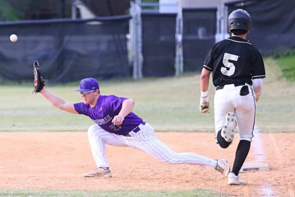 Gainesville's Nate Kemph attempts to make the first-inning catch as Buchholz's J.J. Gardner makes it safely to first base on Wednesday.