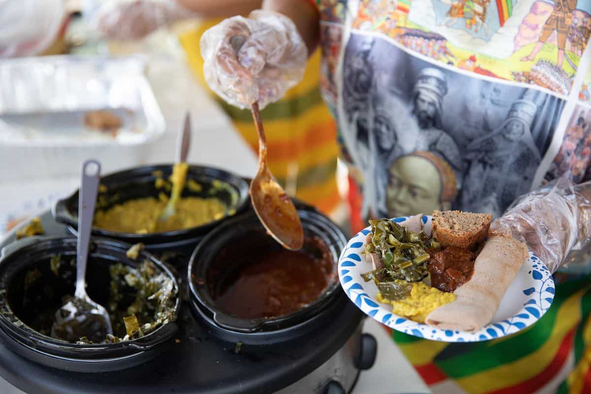 The Ethiopian food included injera, collard greens, beef stew and lentils.