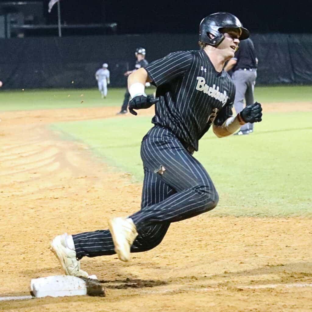 Buchholz's Donny Hiebert rounds third base on the way to a 3-0 Bobcats lead in the bottom of the third inning against Gulf Breeze on Wednesday.