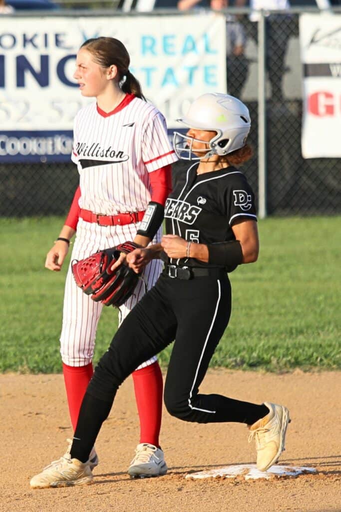 Dixie County's Gracie McKinnon with a second inning double against Williston.