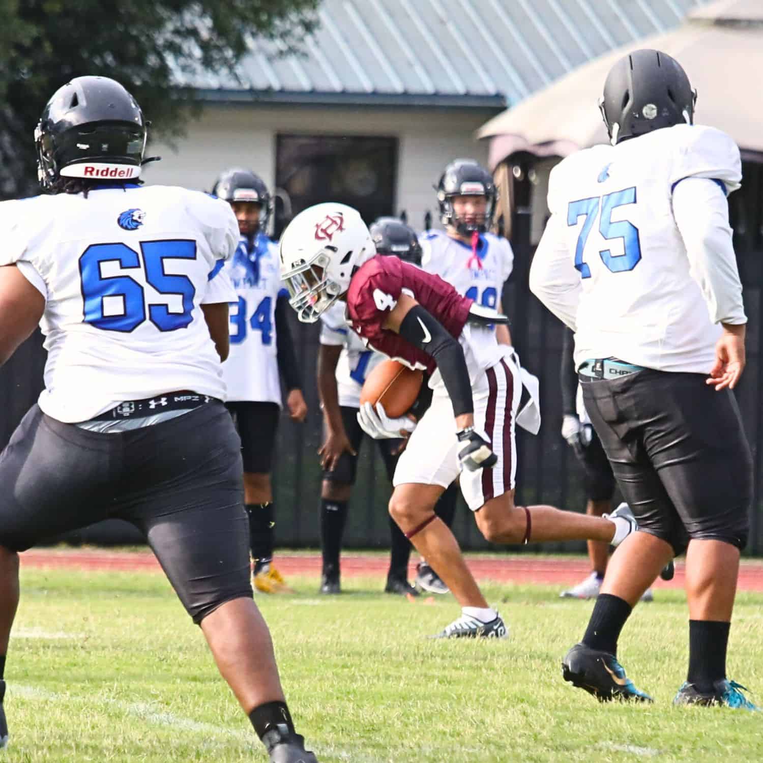 Oak Hall's Aaron Akins (4) with a first quarter interception he returned for a touchdown against Impact Christian on Thursday. Oak Hall's Aaron Akins (4) with a first quarter interception