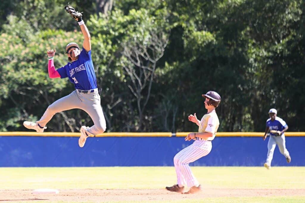 Oak Hall's Harrison Beach make it safely to second against St. Francis' Nicolas Gomez-Vera in the first inning of the District 4-2A championship game on Wednesday.