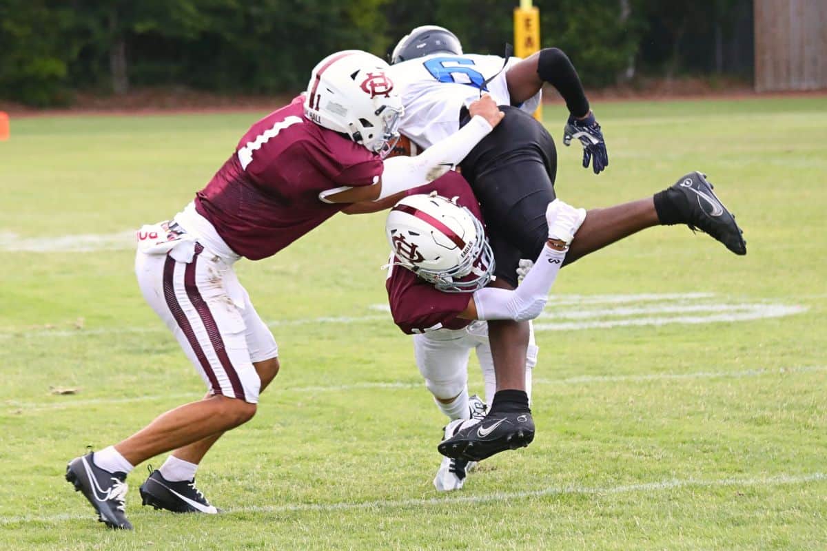 Oak Hall's Jacob Quigley upends an Impact Christian receiver on Thursday. Oak Hall's Jacob Quigley upends an Impact Christian receiver on Thursday.