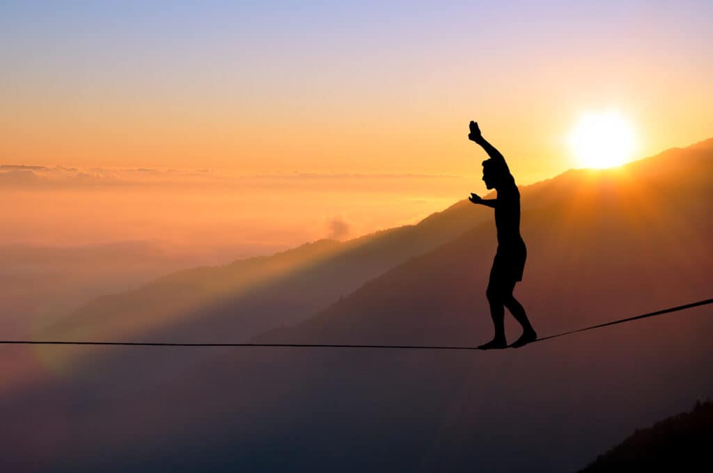 Tightrope walker at sunset