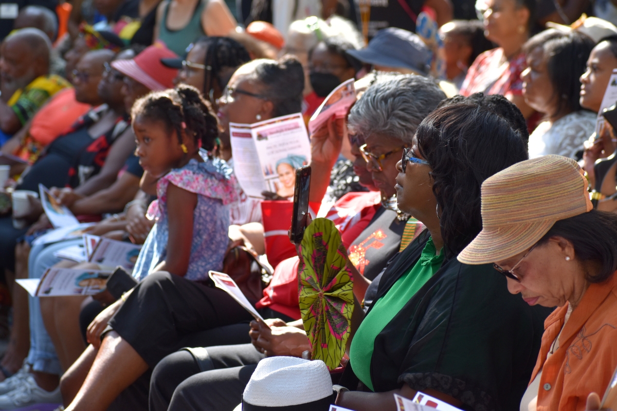 Audience members filled the West Lawn, many dressed in African patterned fabrics or other clothing recognizing African heritage.