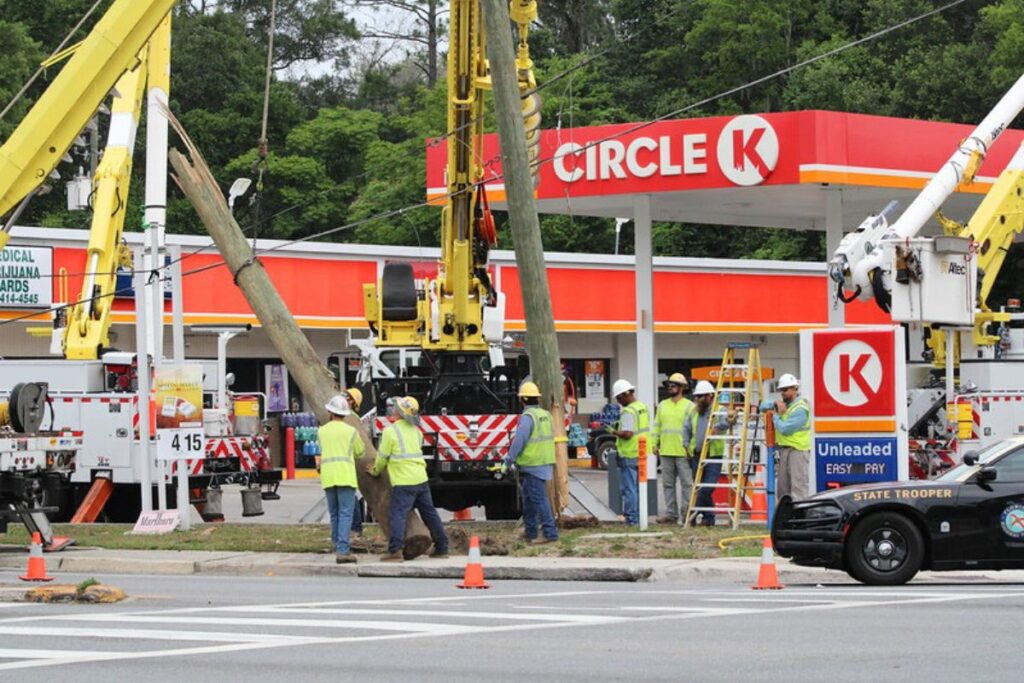 GRU crews switch out a broken utility pole with a new pole following a collision on Wednesday morning.