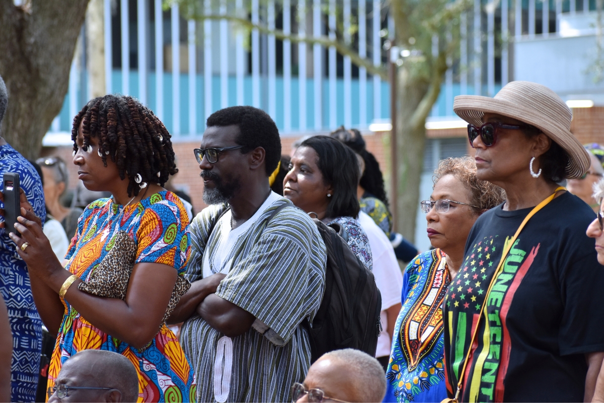 Many attendees dressed for the occasion in African patterned fabrics or other clothing recognizing African heritage.