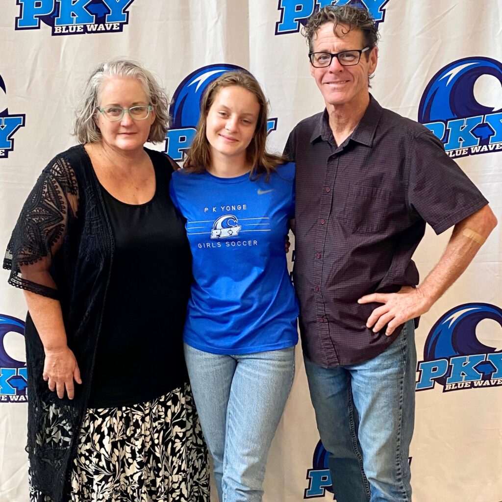 P.K. Yonge's Chloe Westbrooks (center) with her parents at her Dominican University girls soccer signing event.