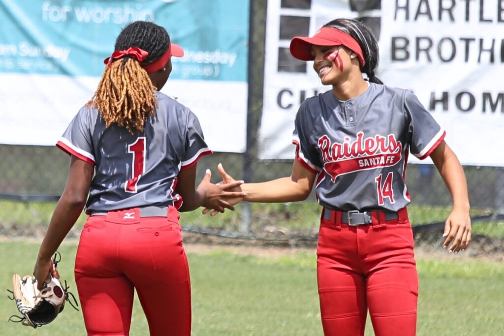 Santa Fe outfielders J'lynn Guyden (1) and Amy Crosby (14)