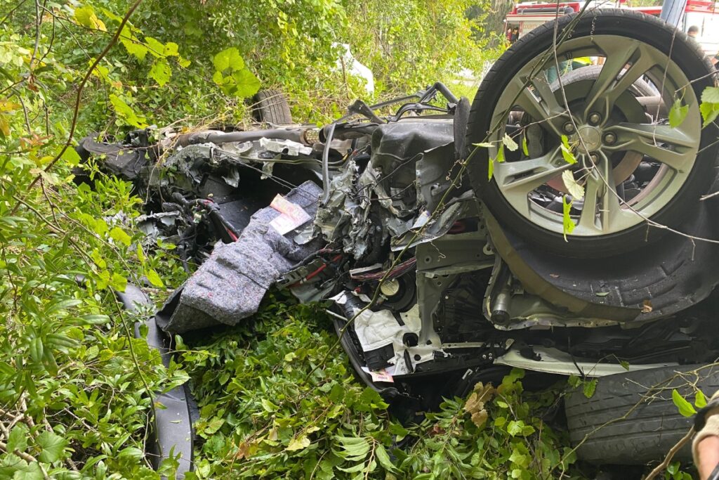 A vehicle hit a pole and overturned at the intersection of Hawthorne Road and SE 43rd Street on Sunday morning.